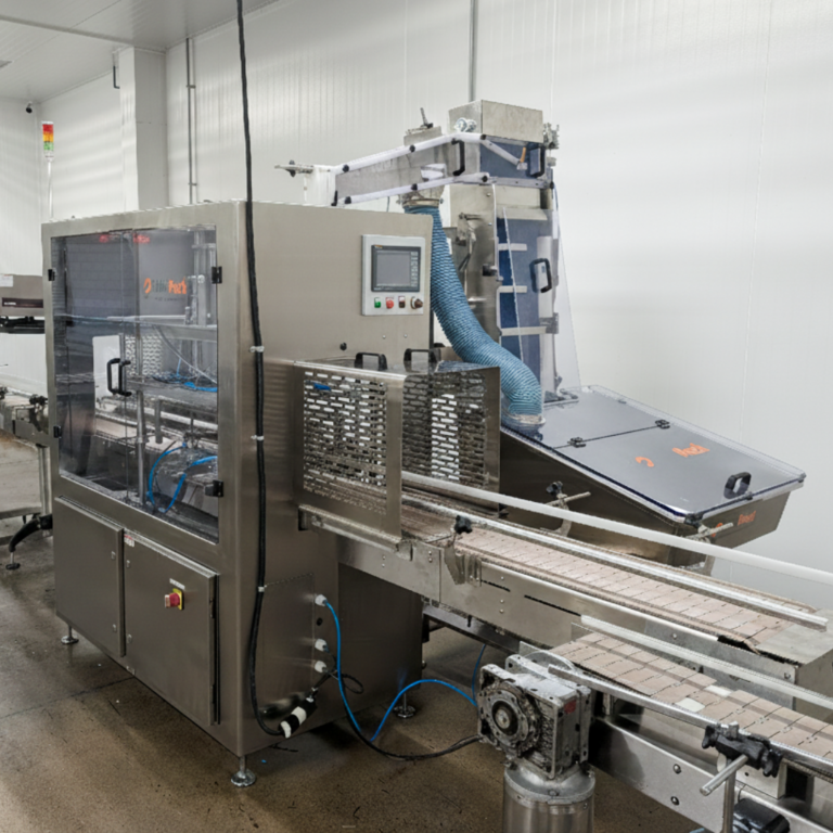 Side view of Link Pack's Automatic capper with sorting elevator