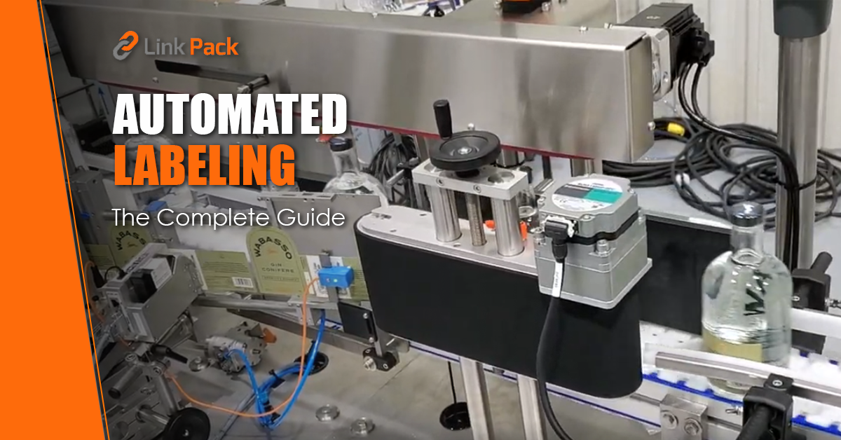 Automated linear labeling machine applying pressure-sensitive labels to glass bottles. Link Pack, Quebec Canada